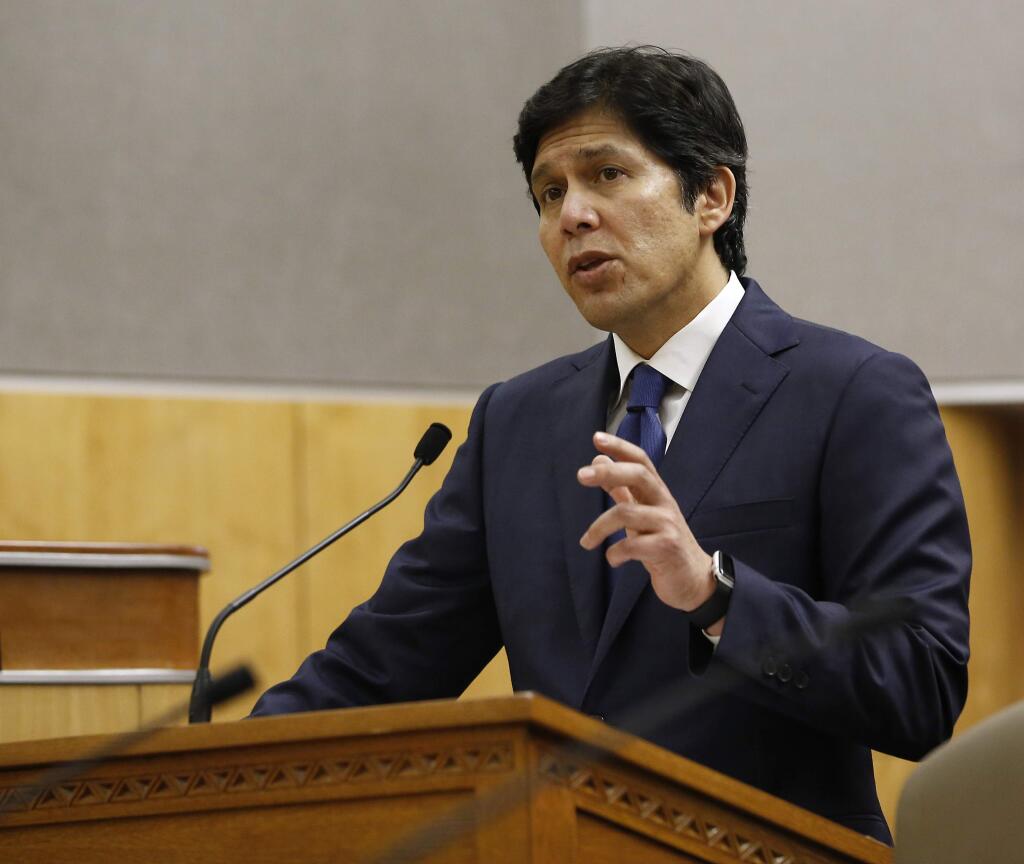 FILE - In this Jan. 31, 2017, file photo, State Sen. President Pro Tem Kevin de Leon, D-Los Angeles, responds to a lawmakers question concerning his bill to prohibit local law enforcement from cooperating with federal immigration authorities during a hearing of the Senate Public Safety Committee in Sacramento. California lawmakers gave initial approval Monday, April 3, to a measure that prevents law enforcement from cooperating with federal immigration officials, a measure that proponents said rebukes President Donald Trump for his immigration crackdown. (AP Photo/Rich Pedroncelli, File)