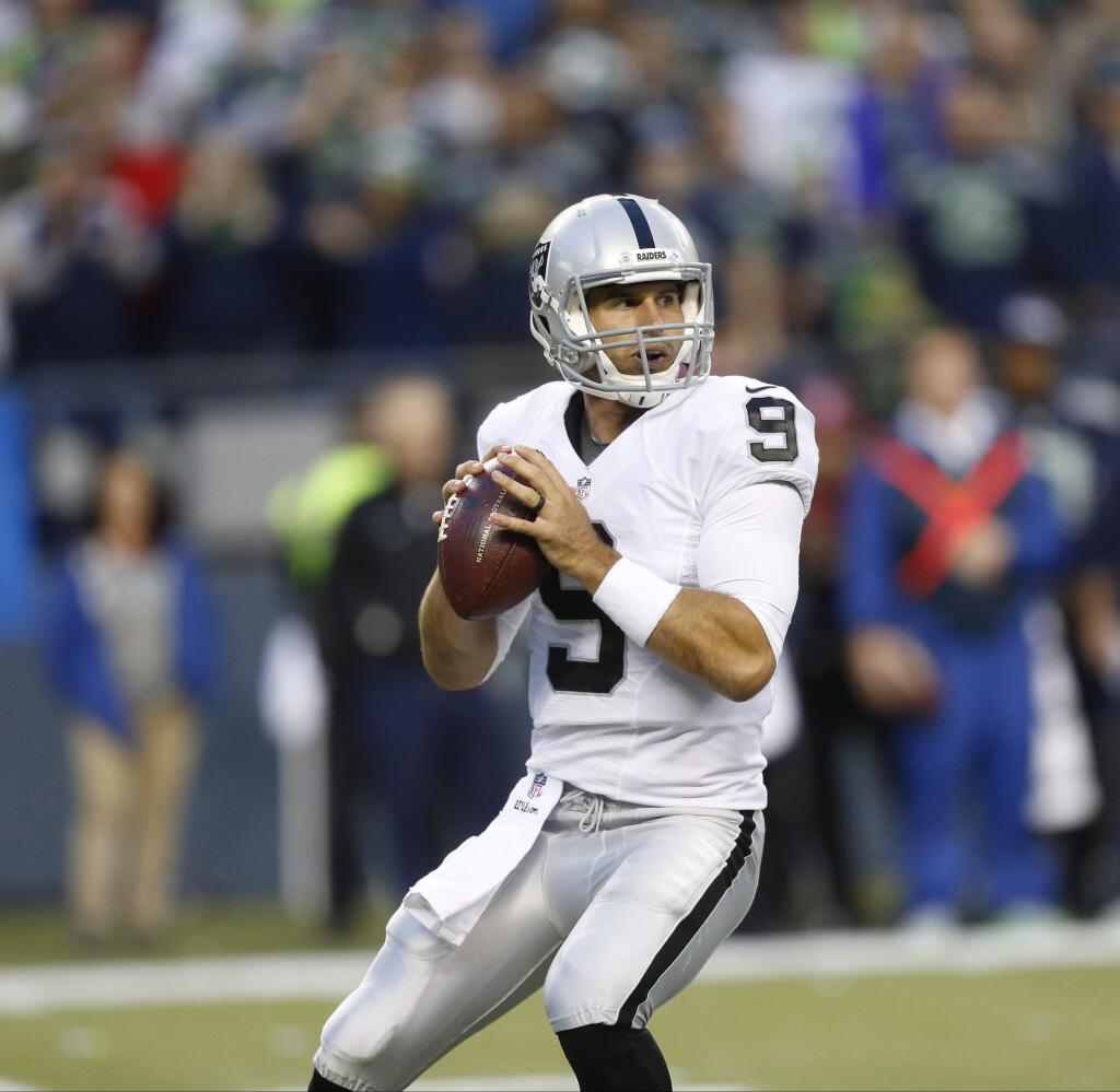 Oakland Raiders quarterback Christian Ponder drops back to pass in the first half of a preseason game against the Seattle Seahawks, Thursday, Sept. 3, 2015, in Seattle. (AP Photo/Stephen Brashear)