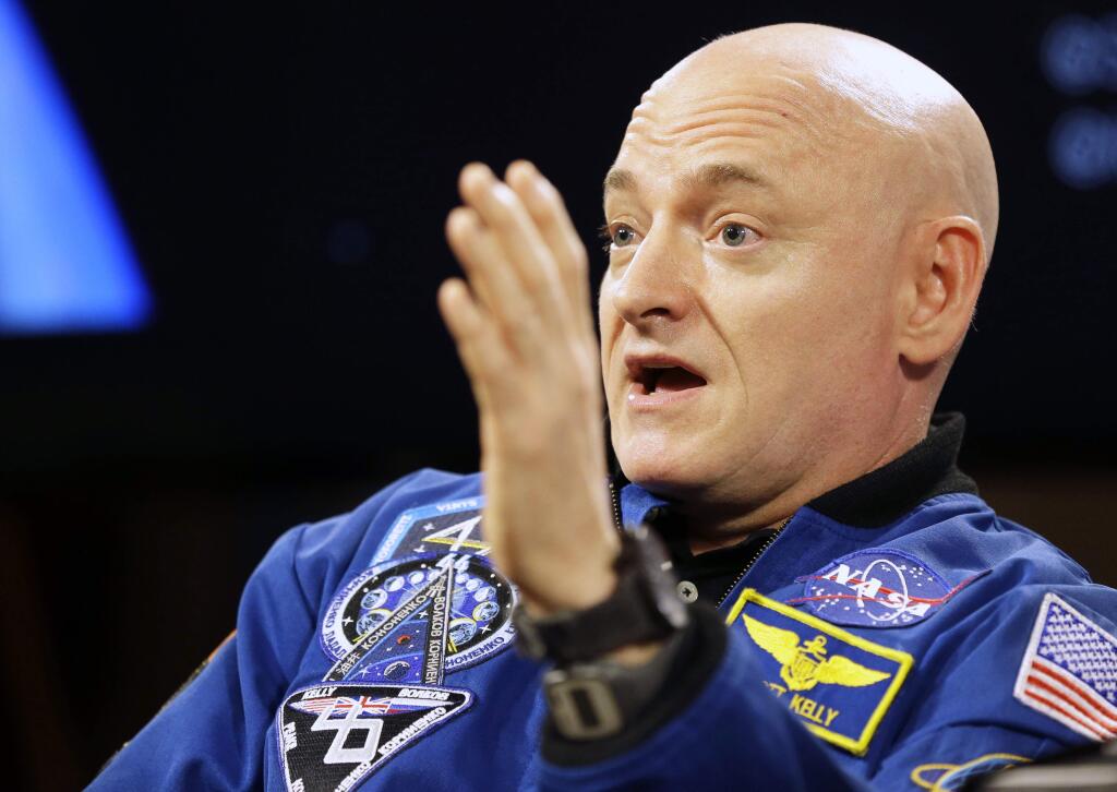 FILE - In a Friday, March 4, 2016 file photo, NASA astronaut Scott Kelly speaks during a press conference, in Houston. Alfred A. Knopf announced Wednesday, April 6, 2016, that they have a book deal with Kelly, who last month returned from a yearlong, record-breaking mission at the International Space Station, for Endurance: My Year in Space and Our Journey to Mars. Knopf said Kelly will discuss the future of space travel and tell his own story. (AP Photo/Pat Sullivan, File)