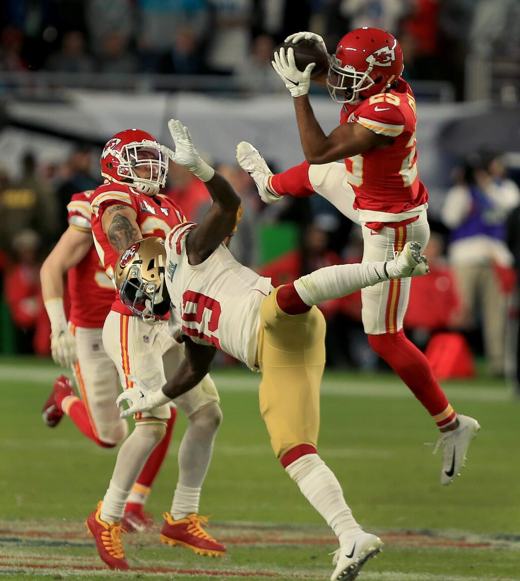 A Hail Mary results in an interception by the Chiefs Kendall Fuller over Deebo Samuel during San Francisco's 31-20 Super Bowl loss to Kansas City, Sunday, Feb 2, 2020 in Miami Gardens. (Kent Porter / The Press Democrat) 2020