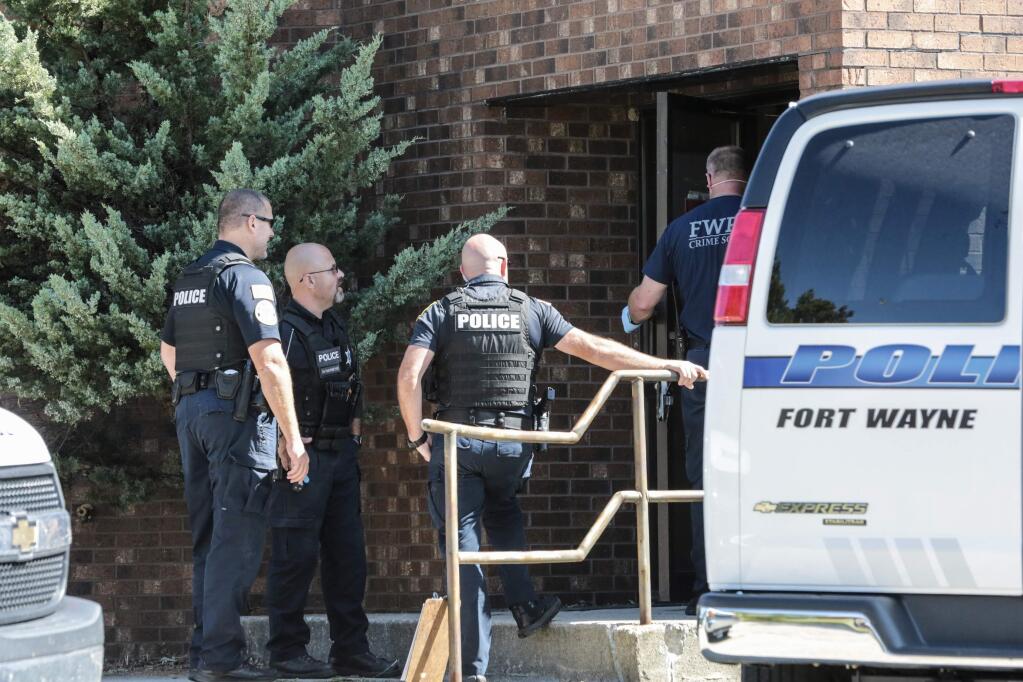 Officers from the Fort Wayne Police Department search the former site of an abortion clinic owned by Dr. Ulrich Klopfer, Thursday, Sept. 19, 2019, in Fort Wayne, Ind. St. Joseph County Prosecutor Ken Cotter said Thursday that authorities have found no fetal remains at a shuttered abortion clinic once operated by the late abortion doctor whose Illinois property was found to contain more than 2,200 medically preserved fetal remains. (Eric Ginnard/The Herald-News via AP)