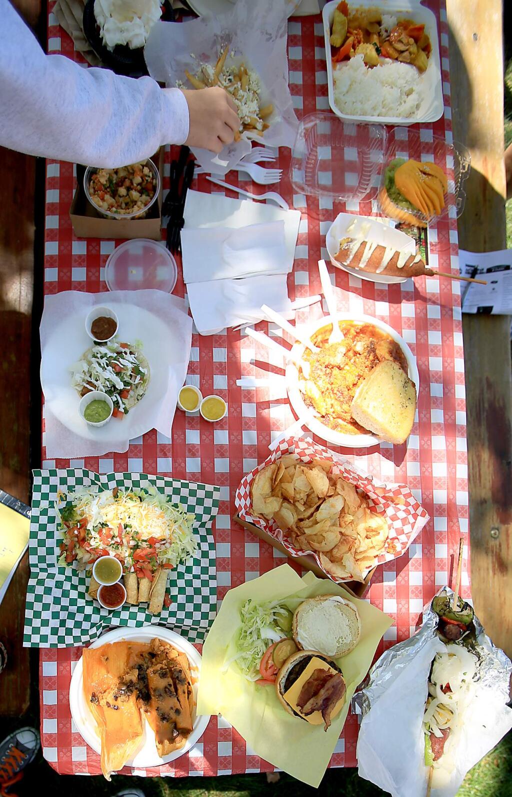 A table full of fair food at the Sonoma County Fair, Friday July 24, 2015 in Santa Rosa. (Kent Porter / Press Democrat) 2015