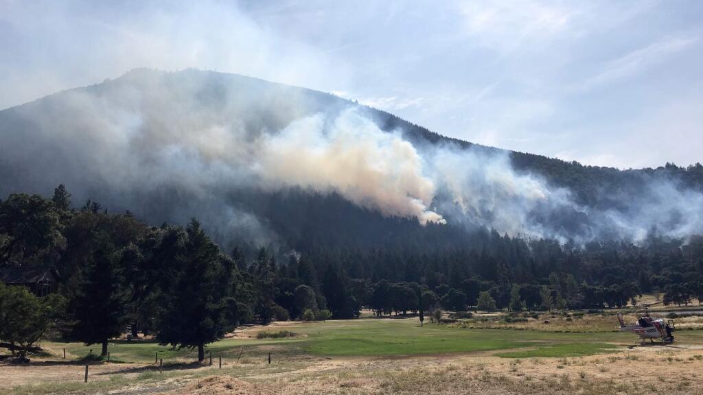 Smoke can be seen from the Golf fire which is burning near the Riviera West and Buckingham Park subdivisions in Lake County on Thursday, Aug. 8, 2019. (KENT PORTER/ PD)