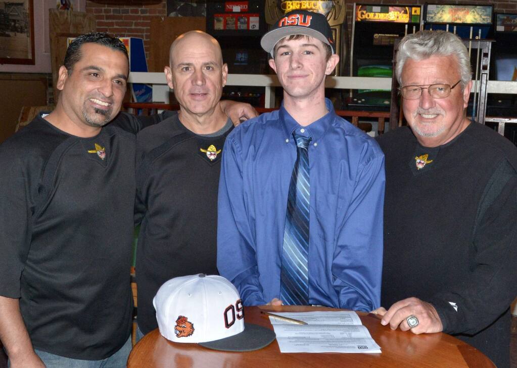 SUMNER FOWLER/FOR THE ARGUS-COURIERCasa Grande High School senior Eric Parnow, flanked by coaches Paul Maytorena, Ralph Gentile and (right) Dominic Wirtz made official his decision to continue his education and play baseball for Oregon State University.