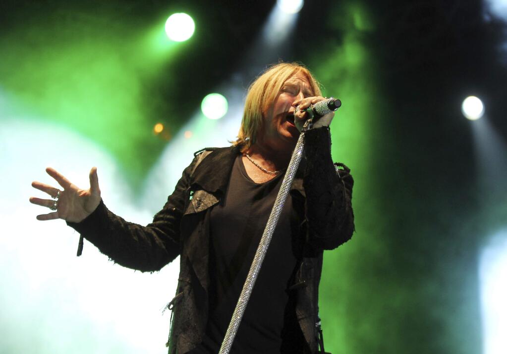 FILE - This June 8, 2012 file photo shows Joe Elliott performing with the band Def Leppard at the after party for the 'Rock of Ages' premiere in Los Angeles. Def Leppard will join Janet Jackson, Stevie Nicks, Radiohead, the Cure, Roxy Music and the Zombies as new members of the Rock and Roll Hall of Fame. The 34th induction ceremony will take place on March 29 at Barclays Center in New York. (Photo by Matt Sayles/Invision/AP, file)