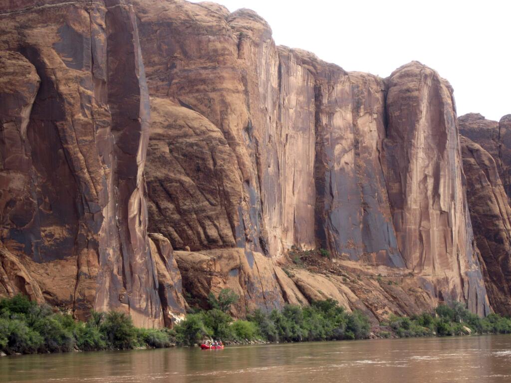 FILE - In this July 25, 2017, file photo, rafters float down the Colorado River near Moab, Utah. Rivers are drying up, popular mountain recreation spots are closing and water restrictions are in full swing as a persistent drought intensifies its grip on pockets of the American Southwest. Climatologists and other experts are scheduled Wednesday, May 23, 2018, to provide an update on the situation in the Four Corners region - where Arizona, New Mexico, Colorado and Utah meet. (AP photo/Dan Elliott, File).