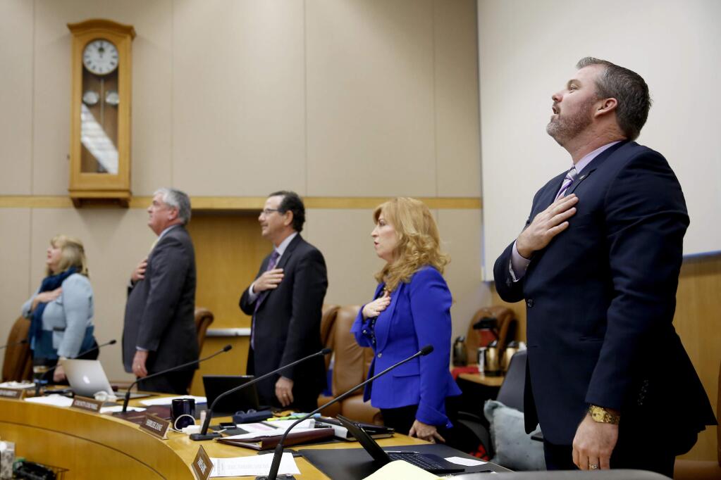4th District Supervisor James Gore says the Pledge of Allegiance during the Sonoma County Board of Supervisors meeting in Santa Rosa, California on Tuesday, January 6, 2015. (BETH SCHLANKER/ The Press Democrat)