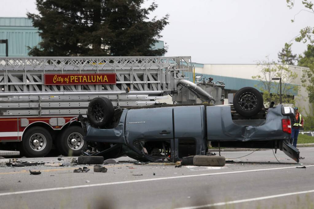 Petaluma police and fire crews respond to the scene of a fatal crash involing at least 6 vehicles on Lakeville Hwy at the S. McDowell Extention and Pine View Way in Petaluma on Tuesday, April 24, 2018. (Beth Schlanker/ The Press Democrat)