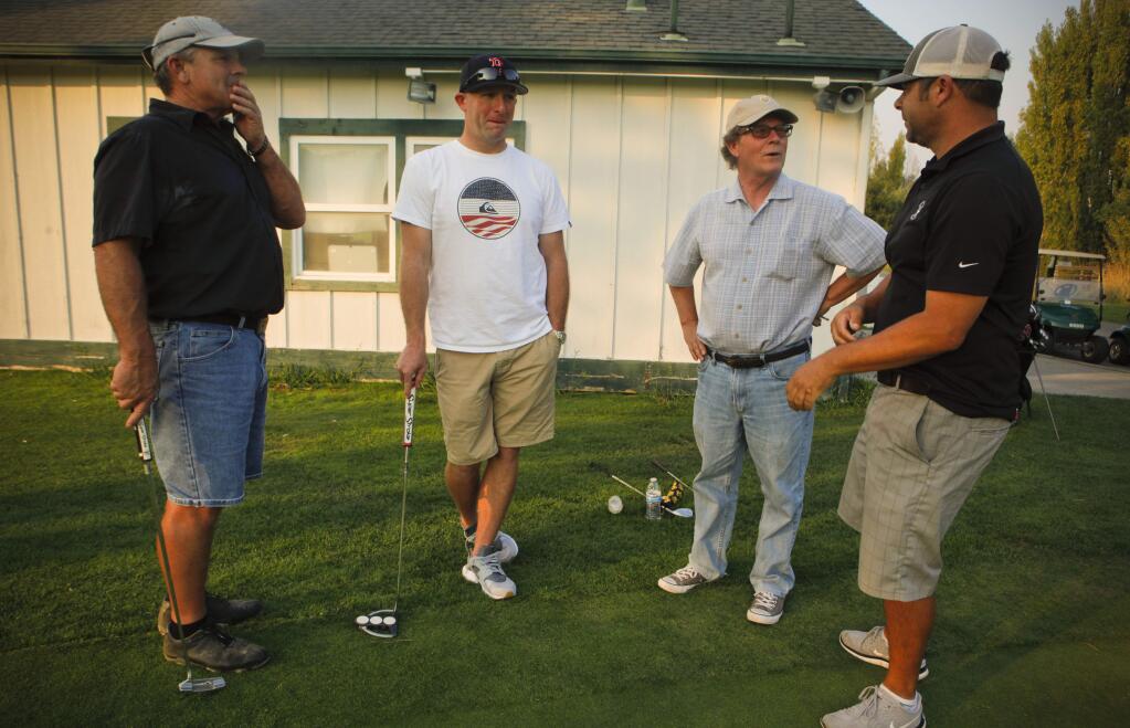 Petaluma, CA, USA. Friday, September 01, 2017._ Golfing buddies (l-r), Lee Smith, Nick Gillis and Mark Richardson recall the events of last week at Rooster Run with golf pro, John Nice (far right). A visiting golfer suffered a heart attack while on the course and they and another friend, Mike Leonard (not pictured) helped to save his life. (CRISSY PASCUAL/ARGUS-COURIER STAFF)