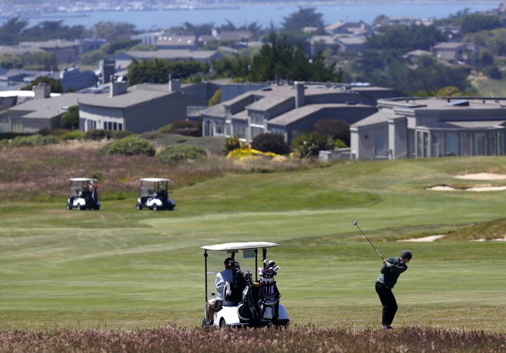 Golfers play on a fairway watered with 100% recycled at The Links at Bodega Harbour on Thursday, June 18, 2015 south of Bodega Bay, California . (BETH SCHLANKER/ The Press Democrat)