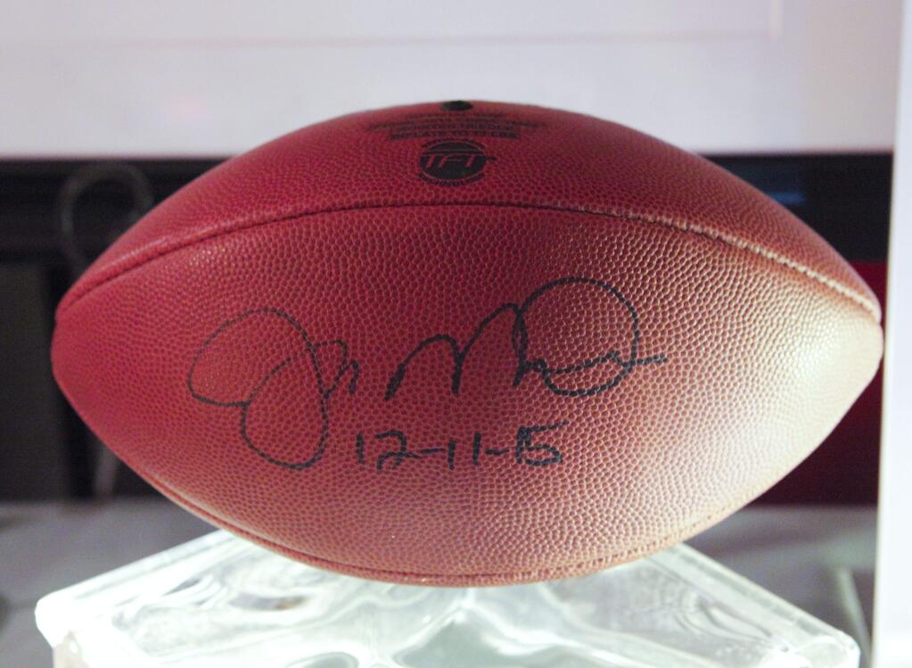 Petaluma, CA, USA. Saturday, September 10, 2016._ Petaluma Education Foundation's 2016 fundraiser 'Cubano Bash - A Night in Old Havana' was held on Saturday night at the Veterans Memorial Building. Silent auction items included this football signed by Joe Montana. (CRISSY PASCUAL/ARGUS-COURIER STAFF)
