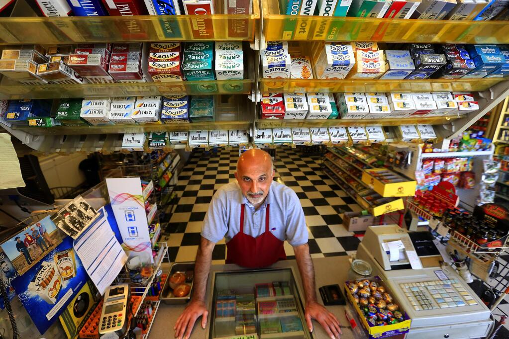Ned Mogannam, owner of Larkfield Liquor & Deli, says he won't be able to compete if the county adopts new policies for selling tobacco. (Photo by John Burgess)