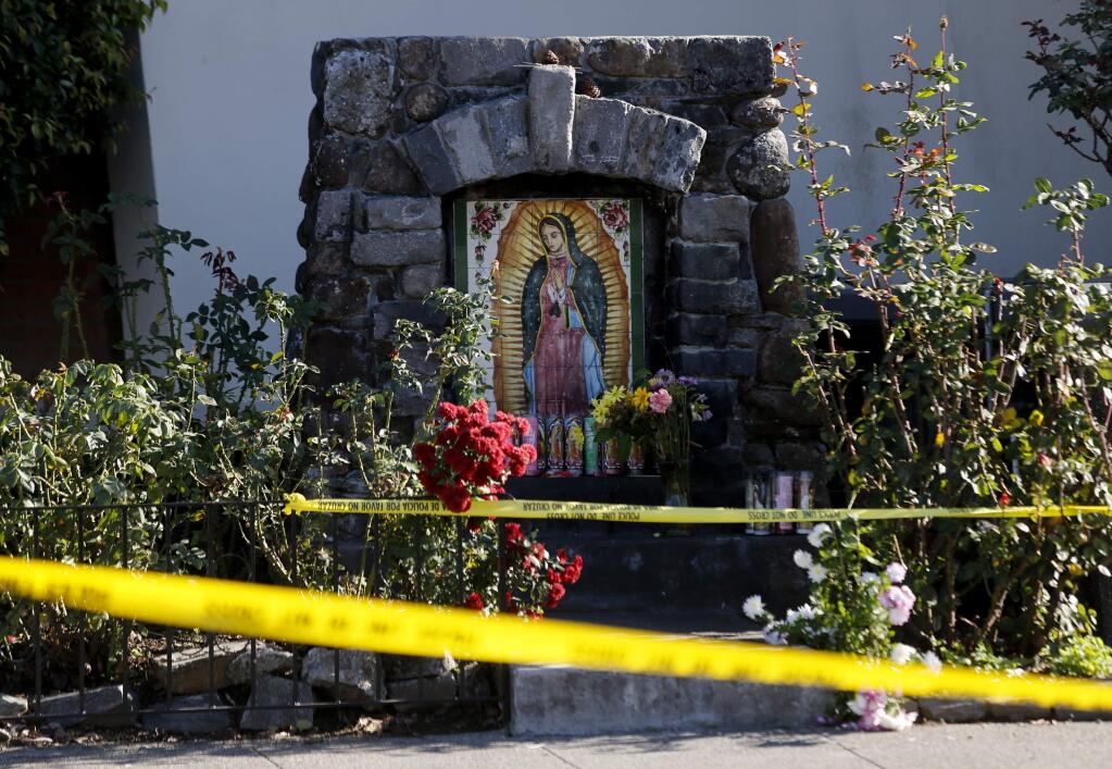 Police tape cordons off the area around St. John's Catholic Church on Monday, November 21, 2016, in Healdsburg, California, as police investigate the death of a child.  (Beth Schlanker / The Press Democrat)