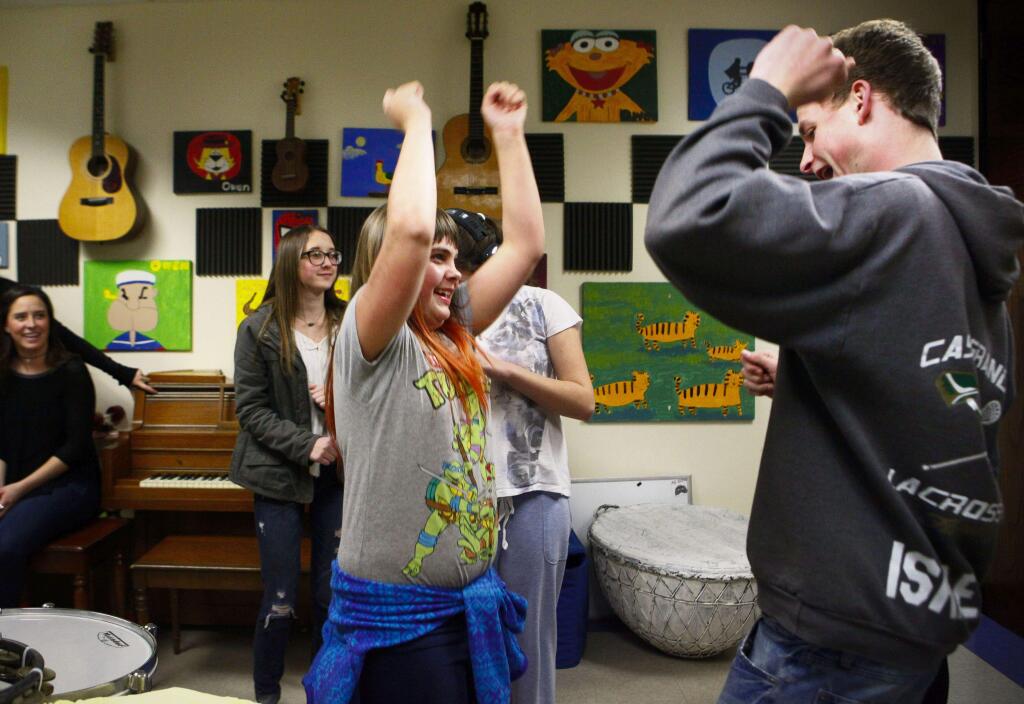 Petaluma, CA. Wenesday, March 01, 2017._ Students from Casa Grande HS like Tobias Israel (right) work with kids at Cypress School. Tobias dances with Lindsay Marelich, 13 in the music room.(CRISSY PASCUAL/ARGUS-COURIER STAFF)