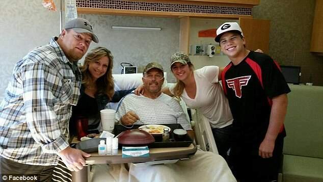 John Sain (center) and his family are shown in a Boise hospital. (WWW.FACEBOOK.COM)