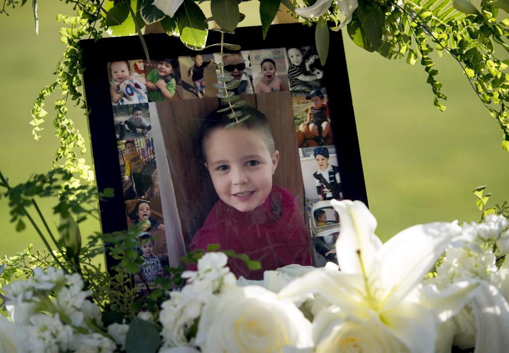 FILE - This July 19, 2017, file photo shows a portrait of 5-year-old Aramazd Andressian Jr. at a memorial service at the Los Angeles County Arboretum in Arcadia, Calif. Aramazd Andressian Sr., who admitted killing his son amid a contentious custody battle, is scheduled to be sentenced Wednesday, Aug. 23, facing a maximum term of 25 years to life in prison. Andressian's attorney said his client pleaded guilty partly to avoid the possibility of prosecutors adding a charge that could result in the death penalty. (Leo Jarzomb /Los Angeles Daily News/SCNG via AP, File)