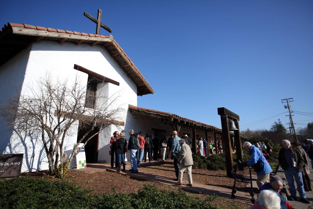 Dozens of people showed up for the 'The Blessing of the Olives' held at Mission San Francisco Solano de Sonoma on First Street East and East Spain Street, Saturday, January 3, 2015. (Crista Jeremiason/The Press Democrat)