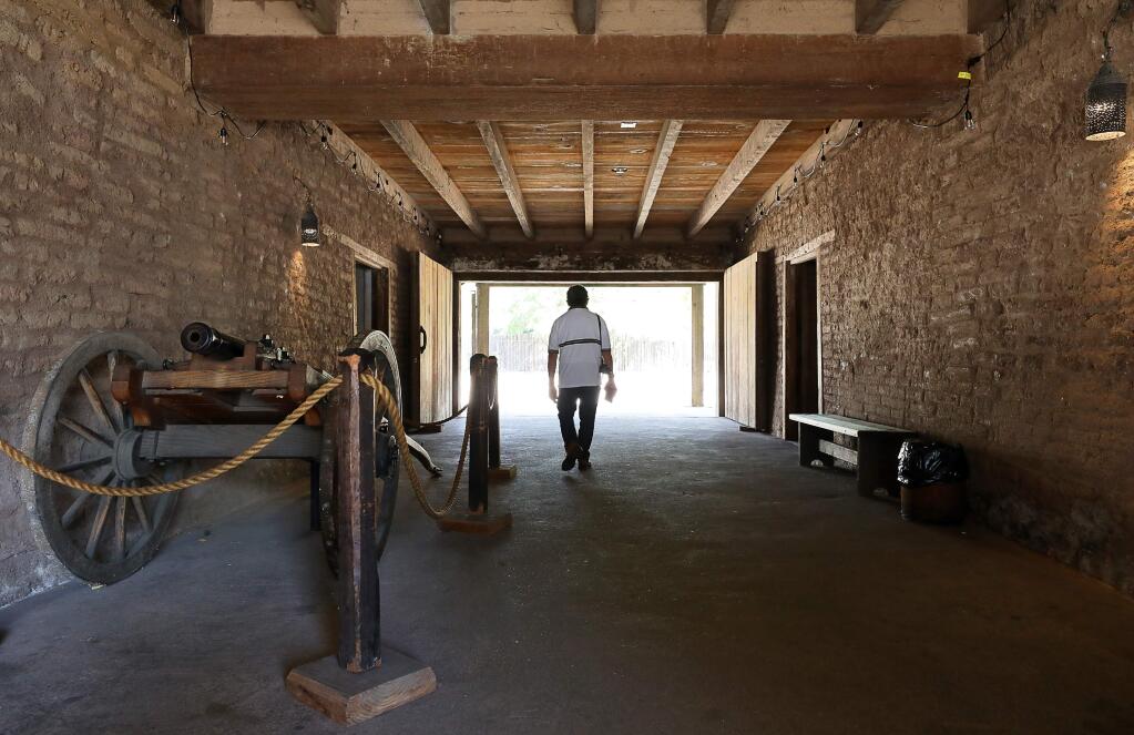 A tourist walks through the main entrance of the Sonoma Barracks at the Sonoma State Historic Park, in downtown Sonoma on Wednesday, September 18, 2019. (Christopher Chung/ The Press Democrat)