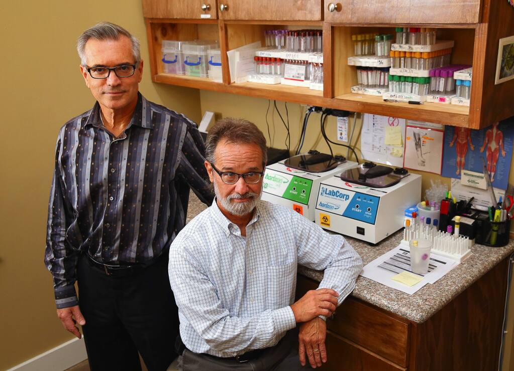 Dr. Eric Gordon, left, and Dr. Wayne Anderson, at Gordon Medical Associates, initiated a study that found evidence, for the first time, that chronic fatigue syndrome is a physical disorder.(Christopher Chung/ The Press Democrat)