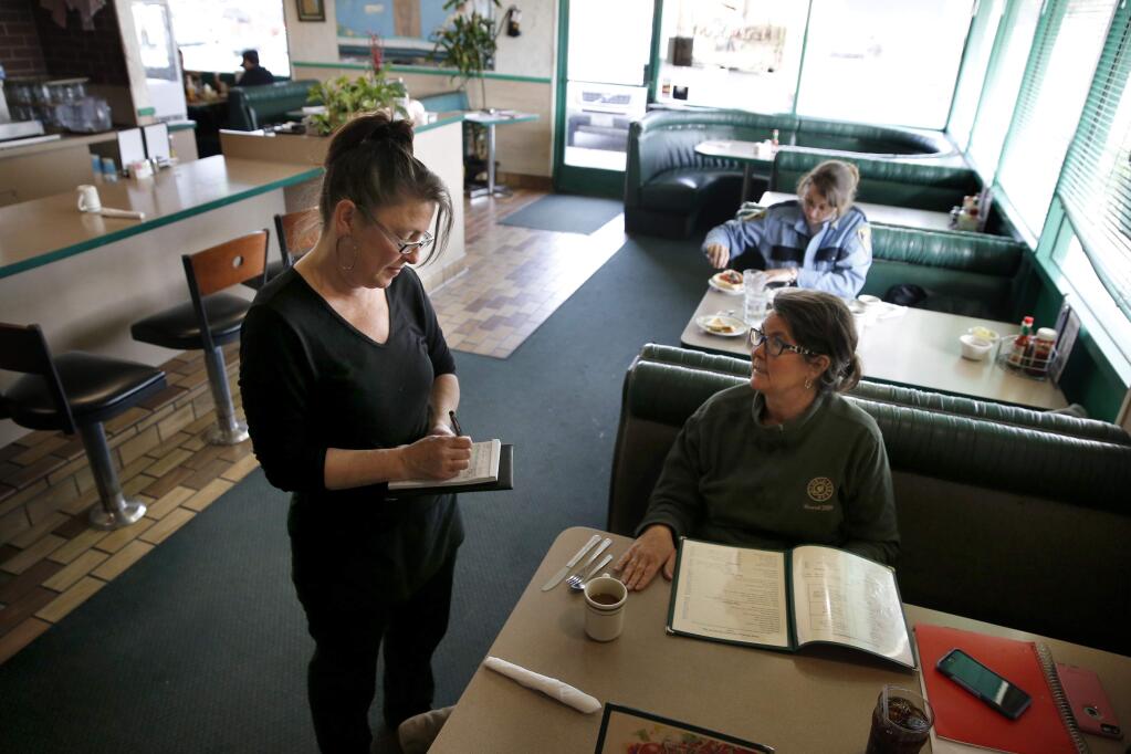 Erin Beaumont takes Brenda Lynch's order at Luigi's Restaurant on Hopper Ave in Santa Rosa, on Wednesday, February 28, 2018. (BETH SCHLANKER/ The Press Democrat)