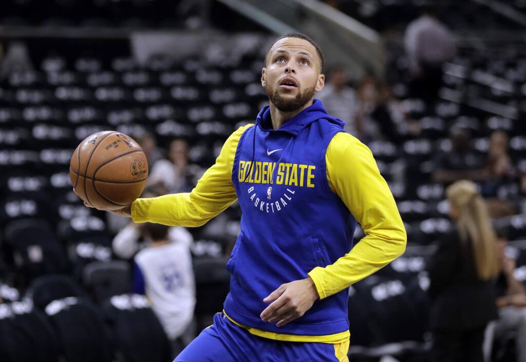 Golden State Warriors guard Stephen Curry warms up before Game 3 of the team's first-round playoff series against the San Antonio Spurs on Thursday, April 19, 2018, in San Antonio. (AP Photo/Eric Gay)