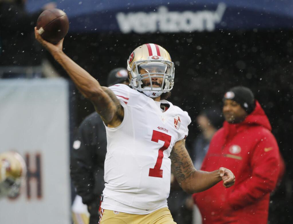 San Francisco 49ers quarterback Colin Kaepernick (7) warms up before an NFL football game against the Chicago Bears, Sunday, Dec. 4, 2016, in Chicago. (AP Photo/Charles Rex Arbogast)