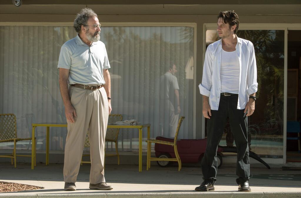 This image released by Focus Features shows Mandy Patinkin, left, and Zach Braff in 'Wish I Was Here.' (AP Photo/Focus Features, Merie Weismiller Wallace)