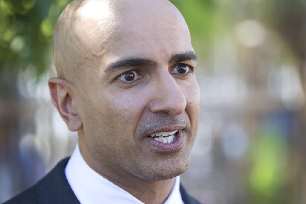 Republican candidate for governor Neel Kashkari discusses issues related to poverty in California during a news conference outside of the River City Food Bank in Sacramento, Calif., on Thursday, July 31, 2014. Kashkari said he spent a week living as a homeless person in search of a job to test Gov. Jerry Brown's claim that the state is making a comeback after the economic downturn. A video crew documented his week. (AP Photo/Steve Yeater)