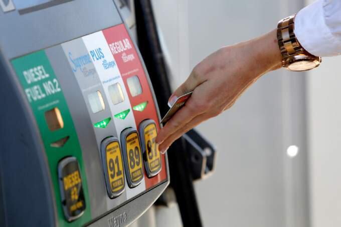 BETH SCHLANKER/ The Press DemocratAmanda Rambo selects the fuel grade as she fills up her tank with gas at the Chevron on Aviation Boulevard in Santa Rosa, on Tuesday, March 11, 2014.
