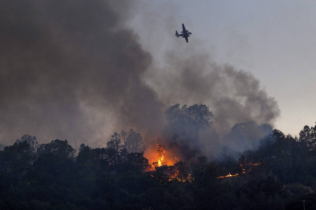 Flames from the Quail Fire burn along a hillside near Winters, Calif., on Saturday, June 6, 2020. (AP Photo/Noah Berger)