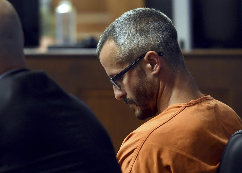 Christopher Watts looks down during his bond hearing at the Weld County Courthouse Thursday, Aug. 16, 2018, in Greeley, Colo. Watts, of Colorado, whose wife and daughters disappeared this week was arrested on suspicion of killing them. (Joshua Polson/The Greeley Tribune via AP, Pool)