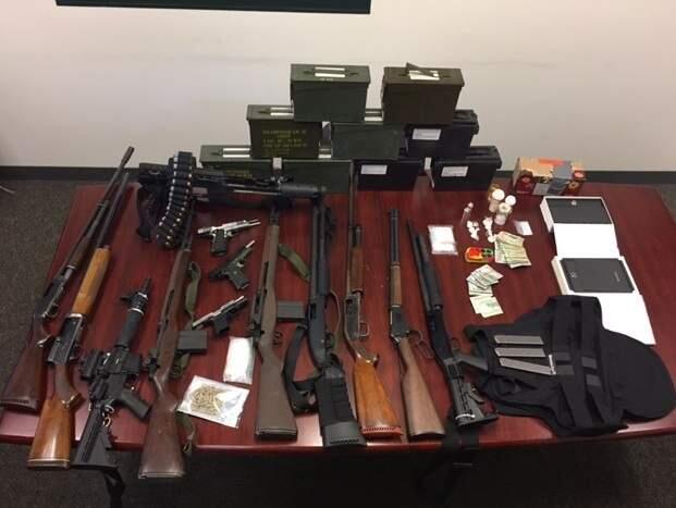 Four people were arrested at a Windsor home where Sonoma County sheriff's detectives found 13 gun, cash and drugs on Tuesday, Aug. 8, 2017. (SONOMA COUNTY SHERIFF'S OFFICE)