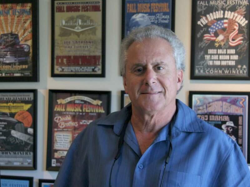 Christian Kallen / Index-TribuneBruce Cohn, who recently sold his 41-year old B.R. Cohn winery in Glen Ellen to Vintage Wine Estates, with a wall full of Doobie Brothers posters from his career managing the California rock band.