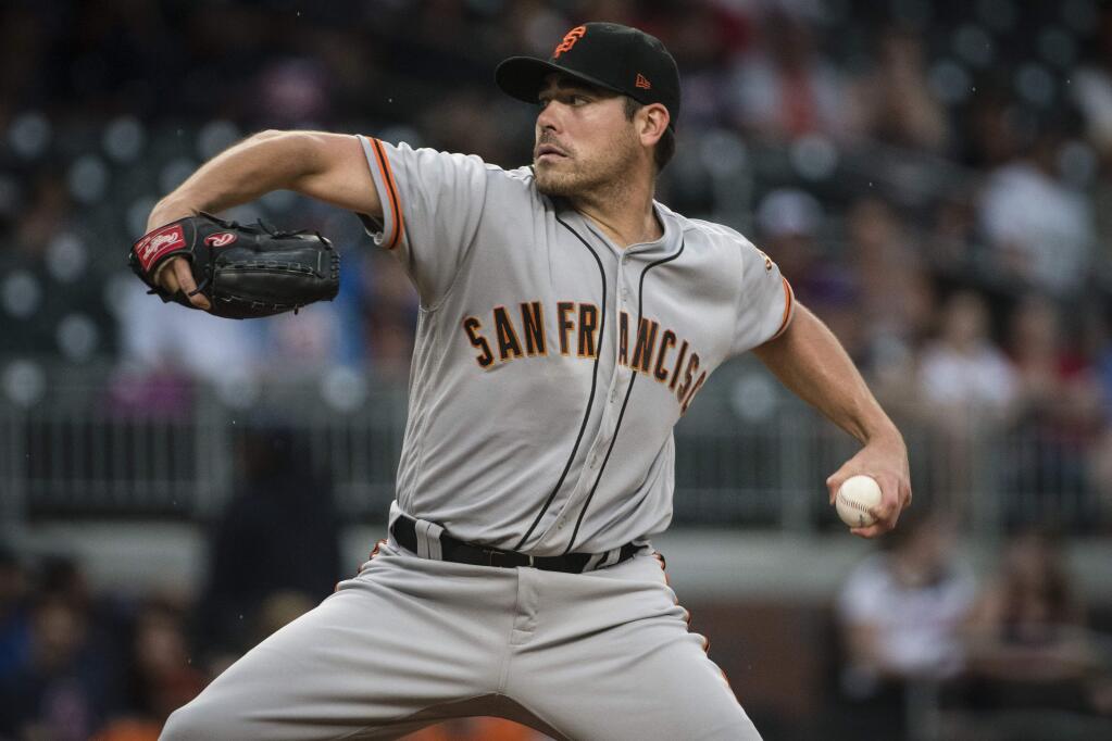 San Francisco Giants' Matt Moore pitches against the Atlanta Braves during the first inning Tuesday, June 20, 2017, in Atlanta. (AP Photo/John Amis)