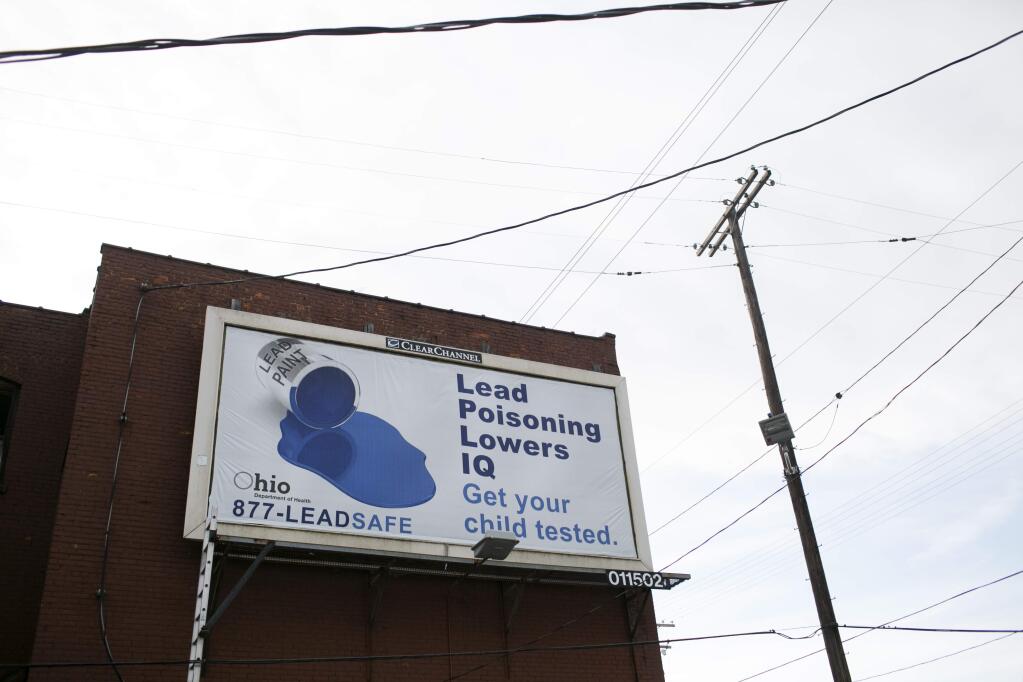 A proposed ballot initiative would relieve three out-of-state corporations of liability for lead contamination traced to paint. (MADDIE McGARVEY / New York Times)