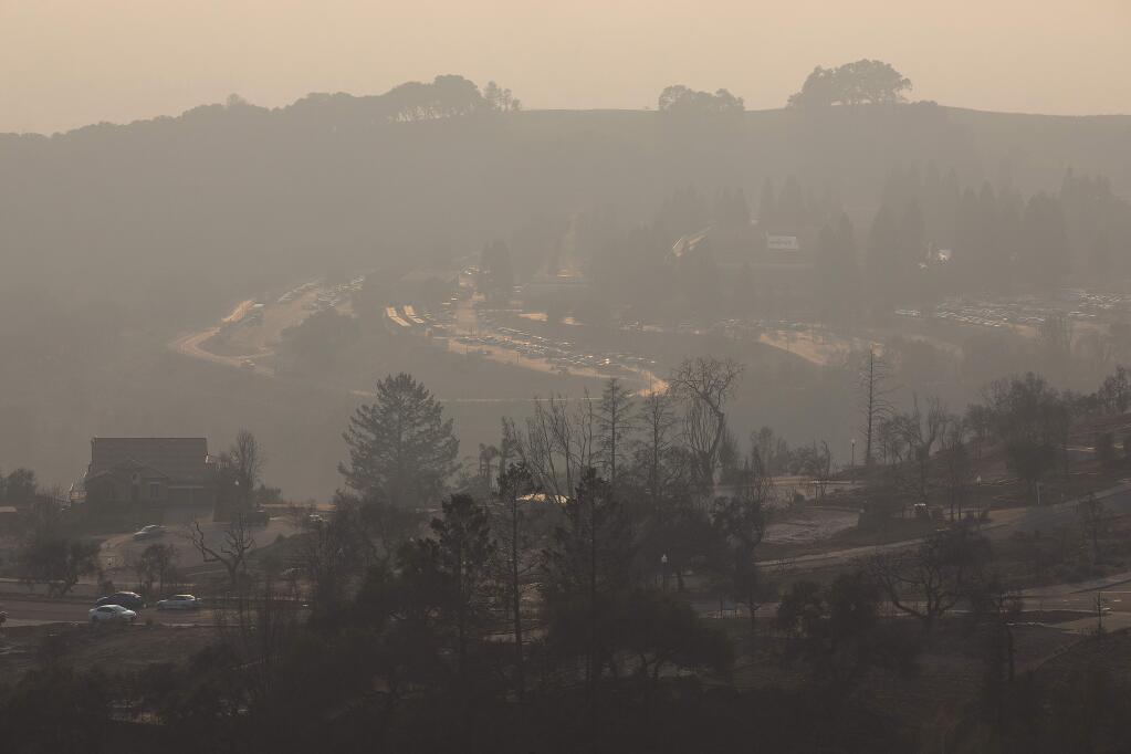 Smoke from the Camp fire reduced visibility from the top of Fountaingrove across to Keysight campus on Monday afternoon. Air quality in Sonoma County remained unhealthy for sensitive groups on Monday. (photo by John Burgess/The Press Democrat)