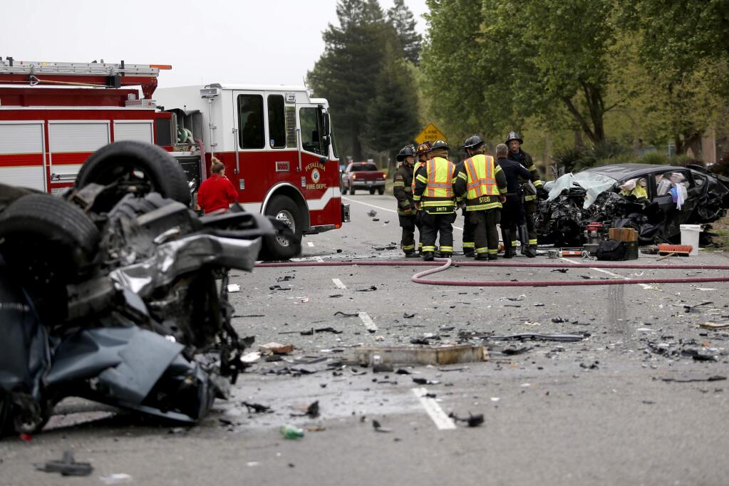Petaluma police and fire crews respond to the scene of a fatal crash involving at least six vehicles on Lakeville Highway at the South McDowell Extension and Pine View Way in Petaluma Tuesday, April 24, 2018. (Beth Schlanker/ The Press Democrat)