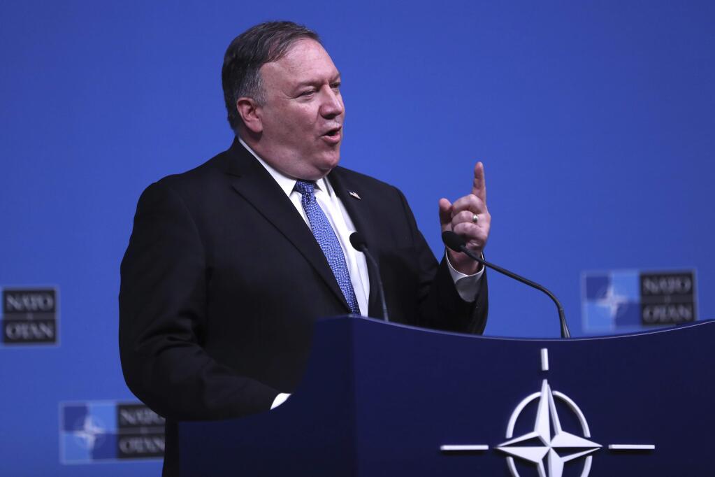 U.S. Secretary of State Mike Pompeo speaks during a media conference after a meeting of NATO foreign ministers at NATO headquarters in Brussels, Tuesday, Dec. 4, 2018. (AP Photo/Francisco Seco)