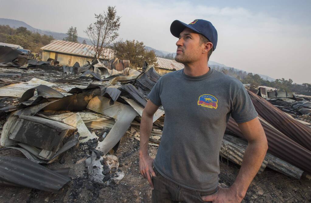 Erich Pearson, CEO of SPARC, surveys the damage done to their Glen Ellen marijuana farm during the early hours of the Nuns Fire, Oct. 9, 2017. (Photo by Robbi Pengelly/Index-Tribune)
