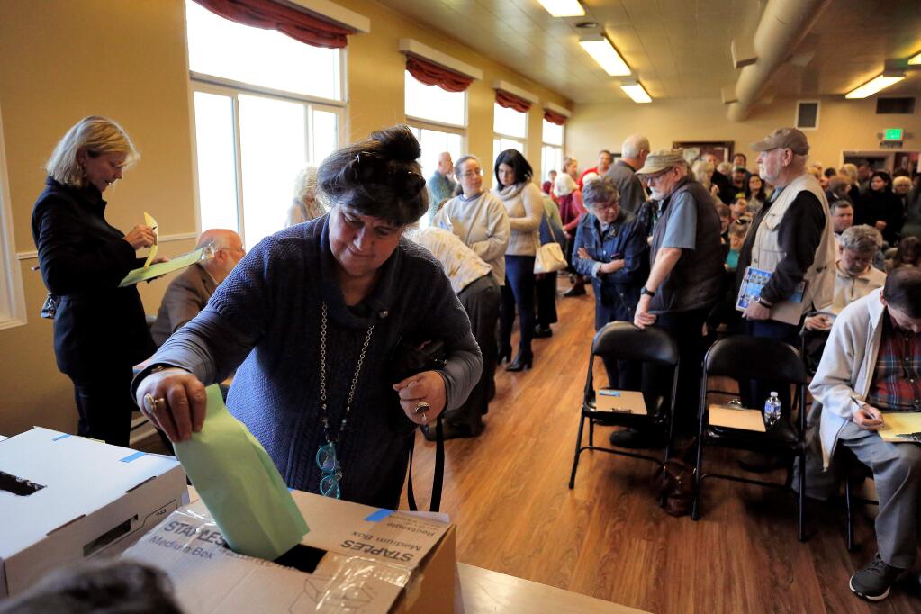 Jini Reynolds of Redwood Valley casts her ballot for the state assembly district 2 executive board representative during the local Democratic Party's biannual post-election review, hosted by Sonoma County Conservation Action at the Odd Fellows Hall in Santa Rosa, California, on Saturday, January 12, 2019. (Alvin Jornada / The Press Democrat)
