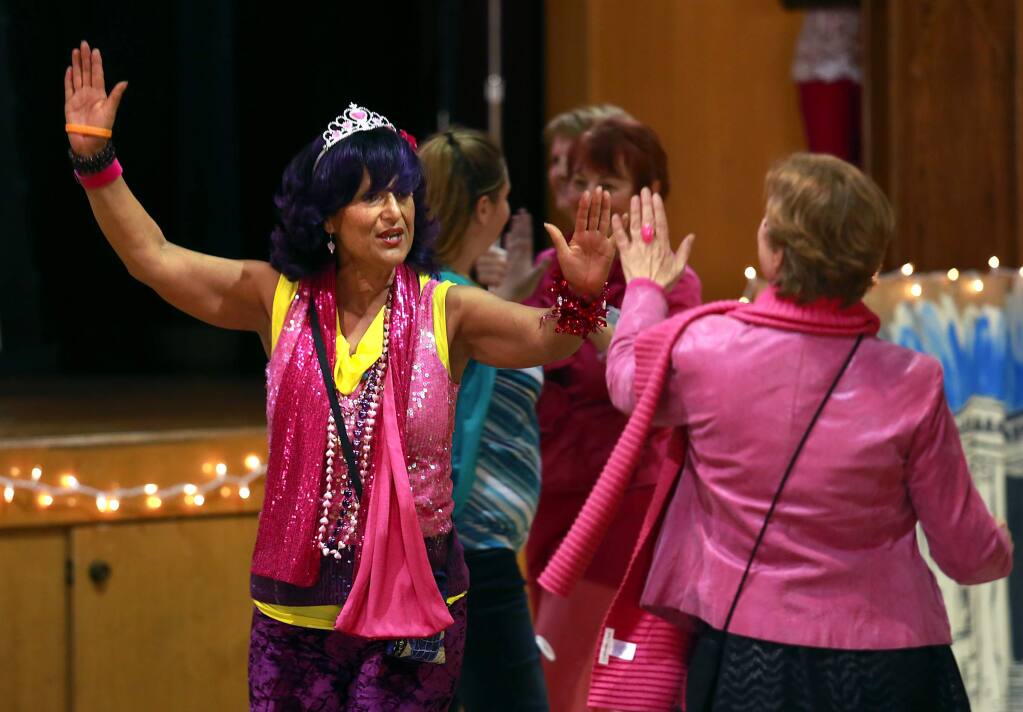 Ms. Rose Rodriguez, of Rohnert Park, dances with a flash mob at the start of the 1 Billion Rising For Justice held to raise awareness against violence towards women and girls. (Photo by John Burgess/The Press Democrat)