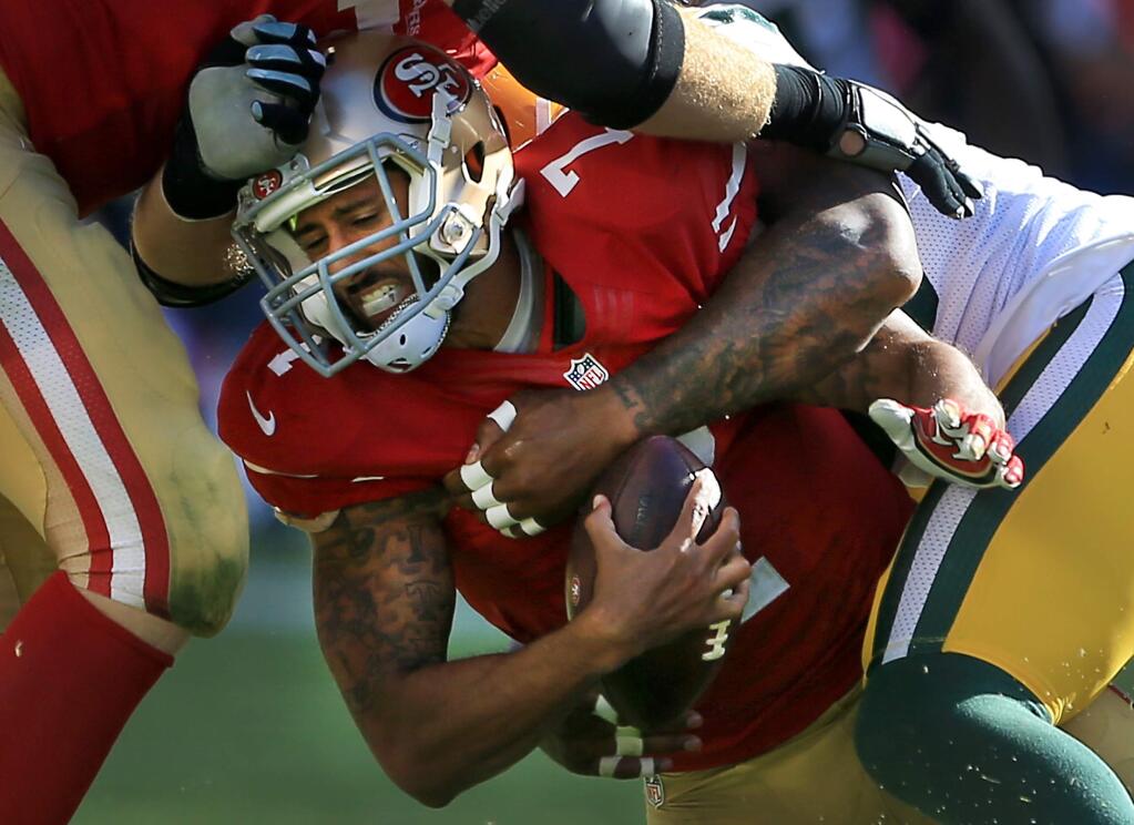 49ers quarterback Colin Kaepernick is sacked in the third quarter at the hands of the Green Bay Packers at Levi's Stadium in Santa Clara, Sunday Oct. 4, 2015. Green Bay beat San Francisco, 17-3. (Kent Porter / Press Democrat)