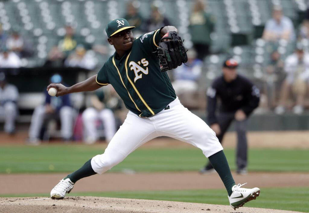 Oakland Athletics starter Jharel Cotton throws during the first inning Wednesday, Aug. 9, 2017, in Oakland. (AP Photo/Marcio Jose Sanchez)