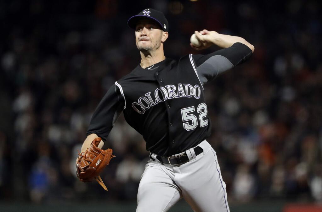 Colorado Rockies relief pitcher Chris Rusin throws to the San Francisco Giants during the fourth inning of a baseball game, Thursday, April 13, 2017, in San Francisco. (AP Photo/Marcio Jose Sanchez)