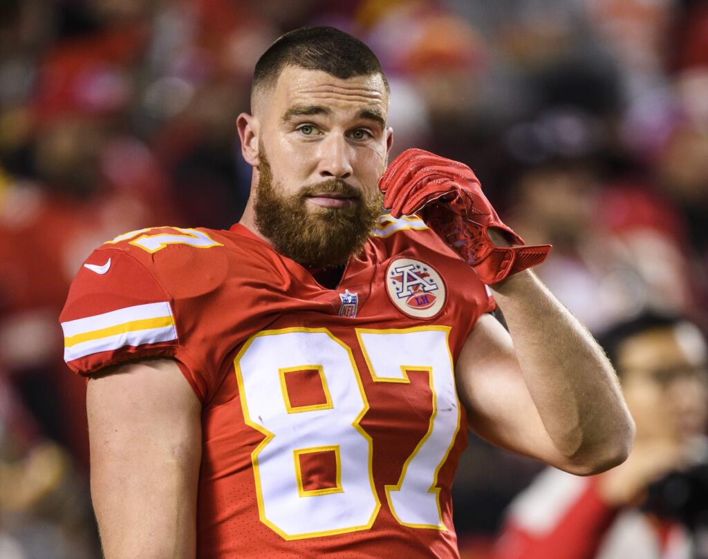 FILE - In this Dec. 13, 2018, file photo, Kansas City Chiefs tight end Travis Kelce (87) during warm-ups before the start of an NFL football game in Kansas City, Mo. Kelce goes into Kansas City's season finale against Oakland with 1,274 yards receiving, the fourth-most ever for a tight end. He needs 54 yards against the Raiders to break the mark set by New England's Rob Gronkowski in 2011. (AP Photo/Reed Hoffmann, File)