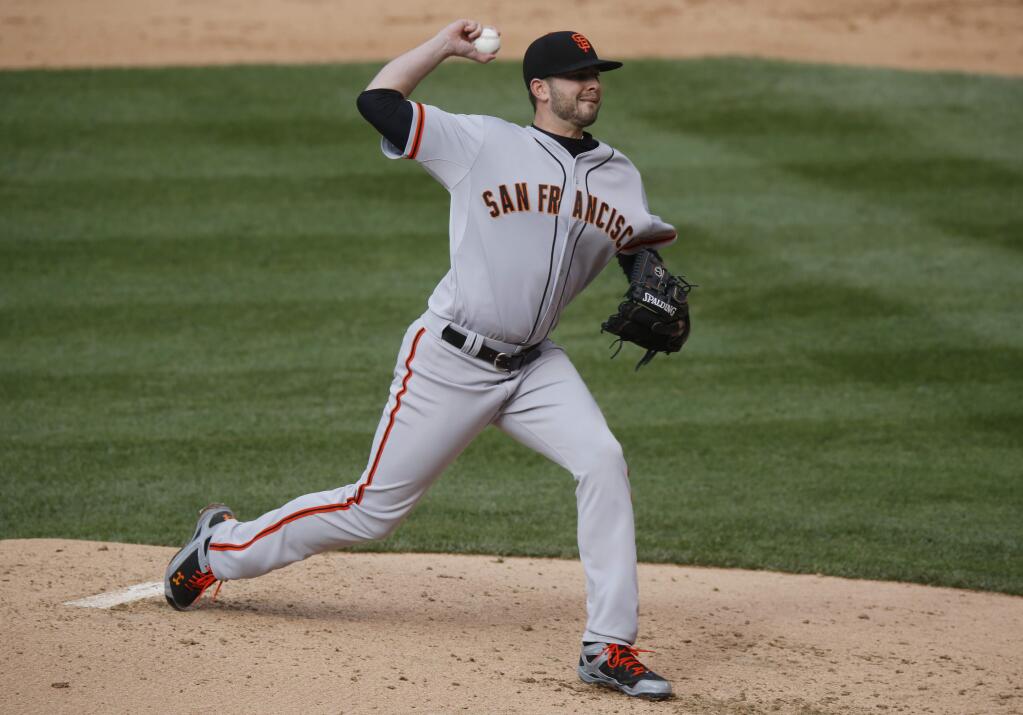 San Francisco Giants starting pitcher Chris Heston works against Colorado Rockies' Wilin Rosario in the fourth inning of Game 1 of a baseball doubleheader Saturday, May 23, 2015, in Denver. (AP Photo/David Zalubowski)