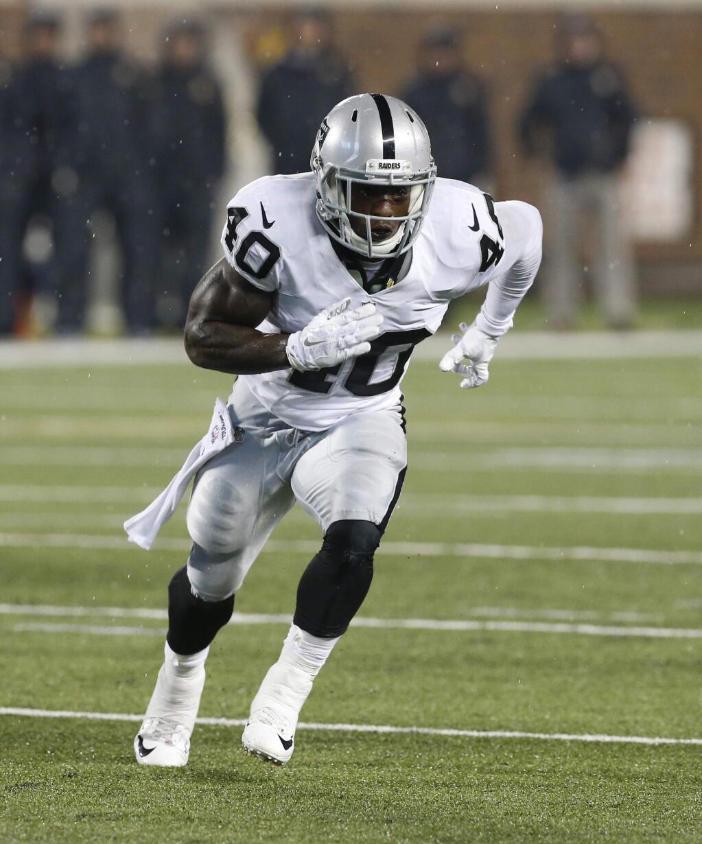 Oakland Raiders running back Michael Dyer (40) runs a pattern during the second half of a preseason NFL football game against the Minnesota Vikings, Saturday, Aug. 22, 2015, in Minneapolis. (AP Photo/Jim Mone)