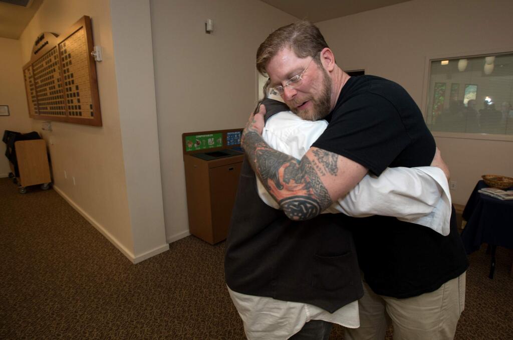 Arno Michaelis, a former skinhead turned author, hugs a member of the congregation, before Michaelis speaks to a crowd at an event held at Congregation Shomrei Torah in Santa Rosa on Saturday, May 4, 2019. (Photo by Darryl Bush / For The Press Democrat)