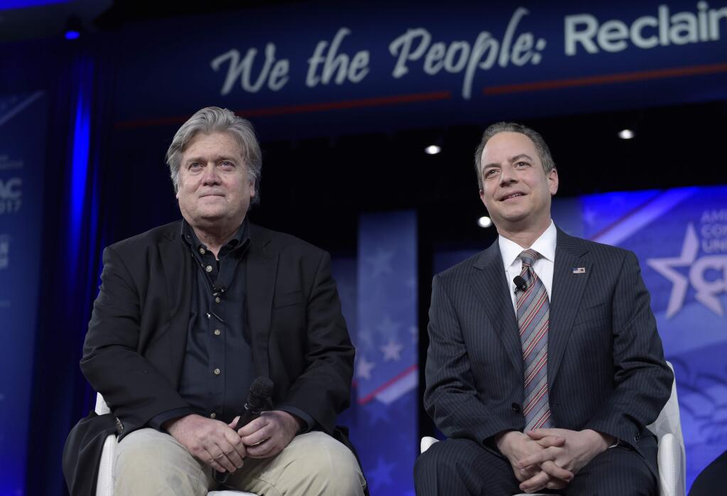 White House Chief of Staff Reince Priebus, right, and White House strategist Stephen Bannon, speak at the Conservative Political Action Conference (CPAC) in Oxon Hill, Md., Thursday, Feb. 23, 2017. (AP Photo/Susan Walsh)