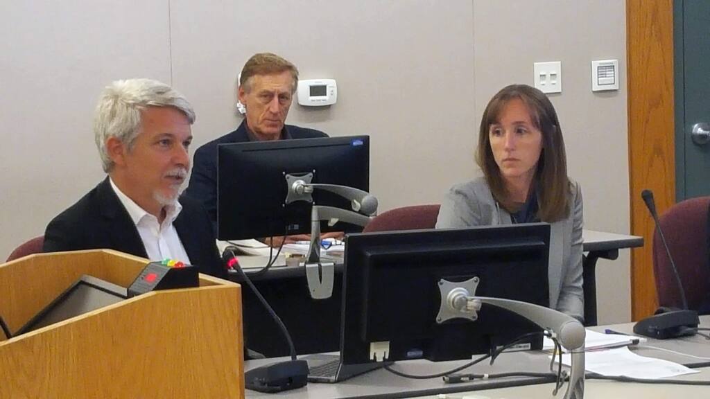 As City Attorney Jeff Walter looks on, Mark Lovelace of HdL Associates and Christie Crowl of Jarvis Fay & Gibson, the two companies engaged by the city to evaluate the cannabis access initiative, report to the Sonoma City Council on Aug. 21, 2018. (Christian Kallen/Index-Tribune)